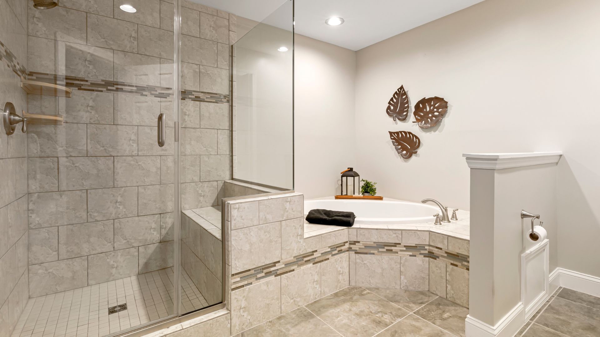 A bathroom with a walk in shower next to a toilet