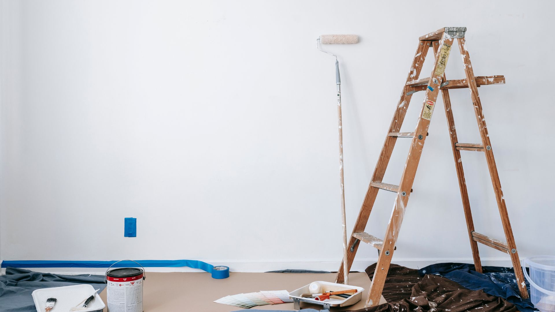 A ladder leaning against a wall in a room
